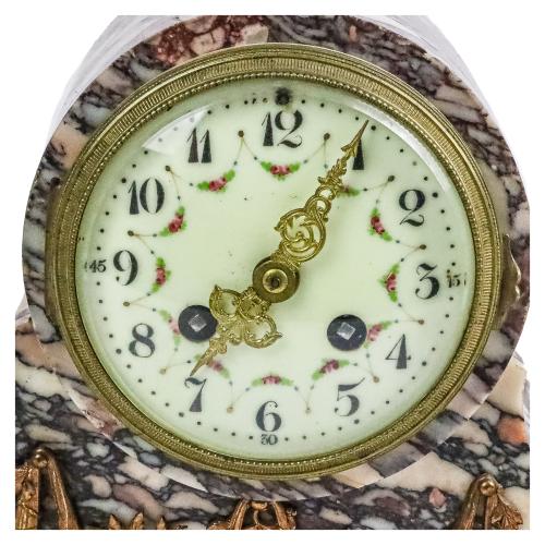 RELOJ CON GUARNICIÓN DE LA PRIMERA MITAD DE SIGLO XX